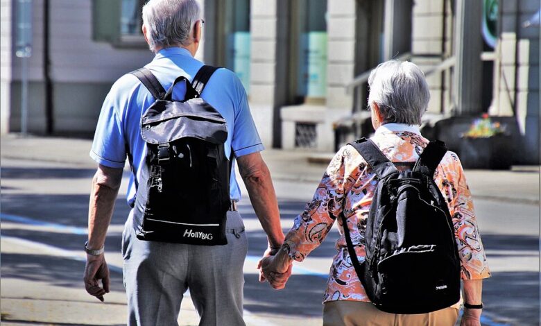 An older couple holding hands, illustrative photograph